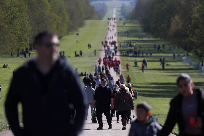 People walking at Windsor Castle after Prince Philip's funeral on Saturday. AP