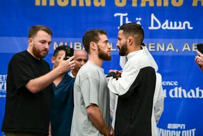 Bader Samreen, from Jordan, left, and Jose Paez Gonzales, from Mexico, face off at Friday's press conference. Khushnum Bhandari / The National
