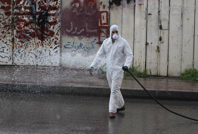 A soldier disinfects an area in the capital Baghdad. AFP