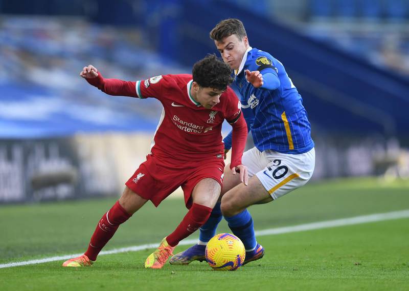 Liverpool's Neco Williams turns away from Solly March of Brighton. Reuters