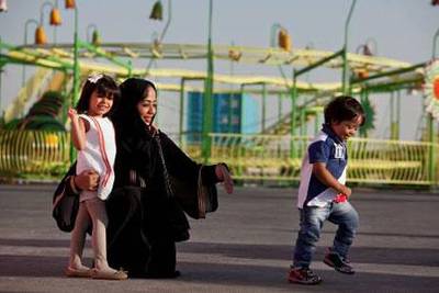 Dubai, United Arab Emirates, December 29, 2012: 
Emirati mother Sarah Al Falasi poses portrait with her son Mohammed, 3, who has Down Syndrome, and her daughter Aljouhara,4, as they spend time together at the Festival City in Dubai, on Saturday, Dec. 29, 2012. Mohammed has been doing well at Inspire Nursery in Dubai.
Silvia Razgova/The National


