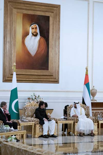ABU DHABI, UNITED ARAB EMIRATES - September 19, 2018: HH Sheikh Mohamed bin Zayed Al Nahyan Crown Prince of Abu Dhabi Deputy Supreme Commander of the UAE Armed Forces (R), receives HE Imran Khan Prime Minister of Pakistan (L), during a reception at the Presidential Airport. 

( Hamad Al Mansouri for Crown Prince Court - Abu Dhabi  )
---