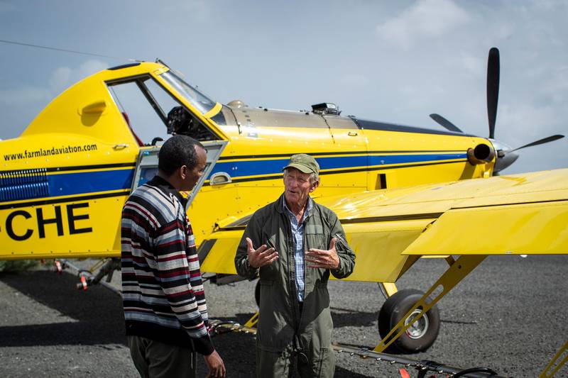 Marcus Dunn, pilot and director at Farmland Aviation, speaks with Salat Tutana, left, the chief agriculture officer in Isiolo county, at an airstrip near Nasuulu Conservancy, northern Kenya. AP Photo