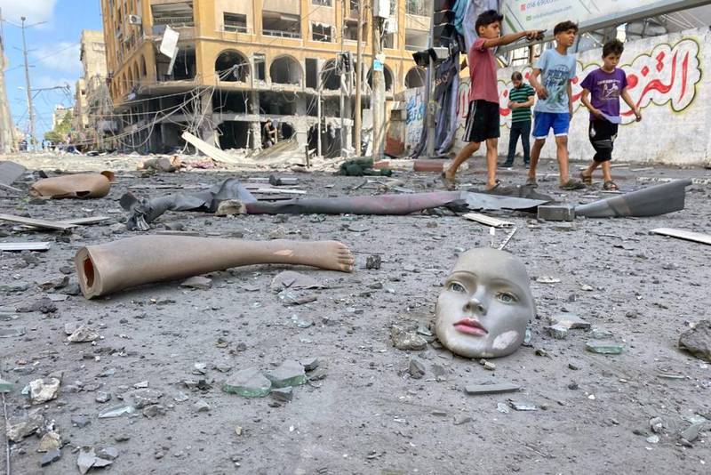 A broken mannequin near a tower building in Gaza City that was hit by Israeli air strikes during the flare-up of Israeli-Palestinian violence. Reuters