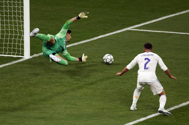 Real goalkeeper Thibaut Courtois makes a save from Mohamed Salah. Reuters