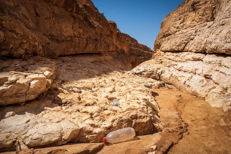Bottles find their way into remote locations, including the sandstone canyons near Medes, on the Algerian border in southern Tunisia.