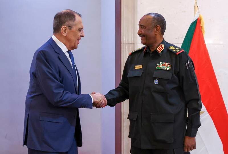 Russian Foreign Minister Sergey Lavrov shakes hands with Sudan's military leader Gen Abdel Fattah Al Burhan in Khartoum, on February 9. EPA