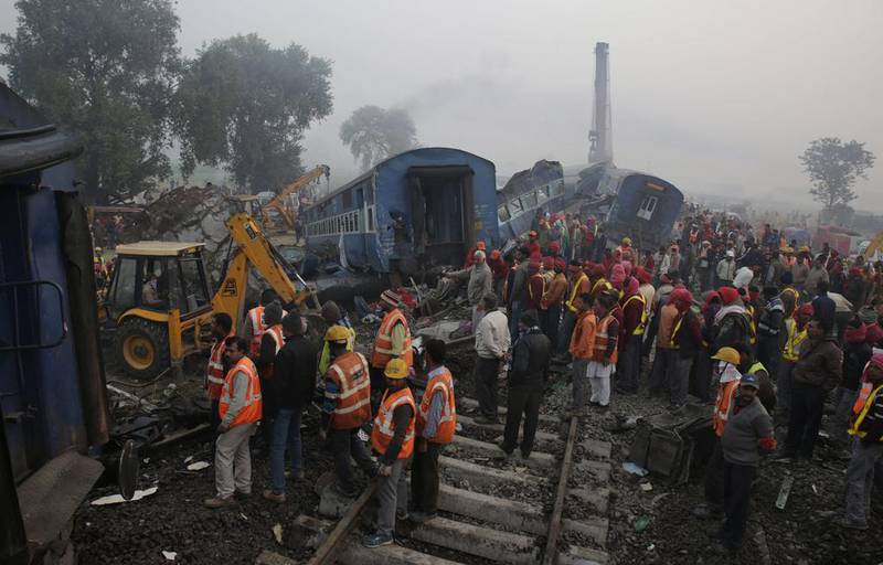 Rescuers search for train crash survivors near Pukhrayan village in Kanpur, Uttar Pradesh, India. Rajesh Kumar Singh / AP Photo