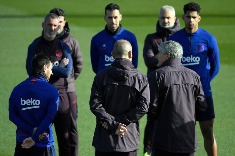 Barcelona manager Quique Setien talks to players during a training session at the Joan Gamper Sports City training ground. AFP