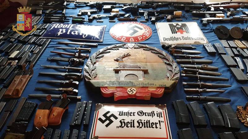 Italian Police handout shows a large arsenal of weapons, including an air-to-air missile, that they say they seized in raids on neo-Nazi sympathisers, in Turin, Italy July 15, 2019. Polizia di Stato/Handout via REUTERS   ATTENTION EDITORS - THIS IMAGE HAS BEEN SUPPLIED BY A THIRD PARTY.