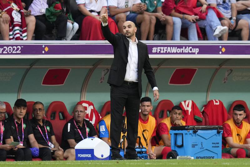 Morocco's head coach Walid Regragui talks to his team during. AP