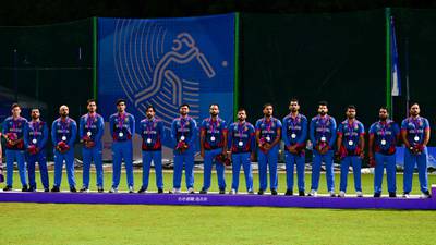 Afghanistan's players pose with their silver medals. AFP