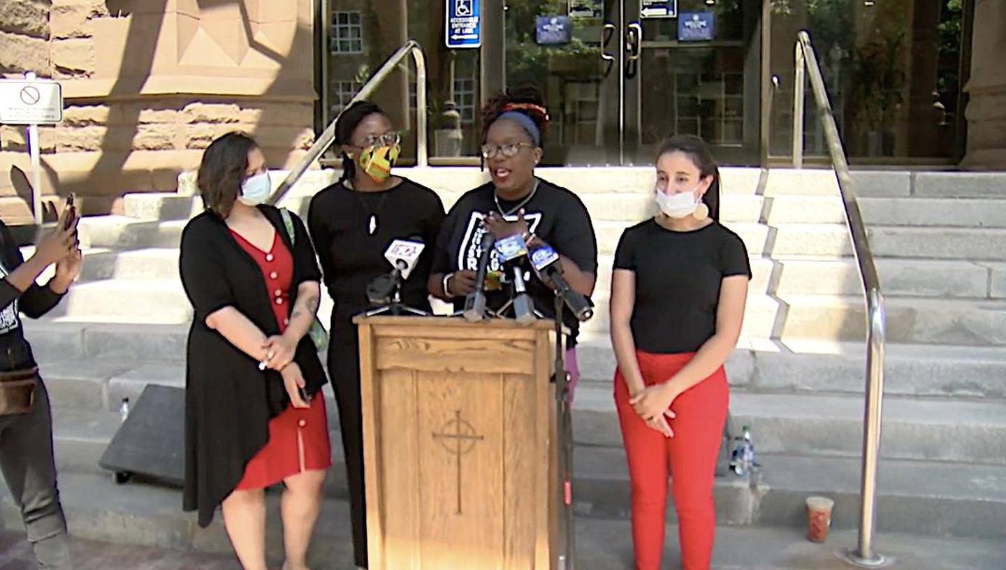 Free The People ROC held a news conference in front of Rochester's City Hall to discuss divestment of police funding.