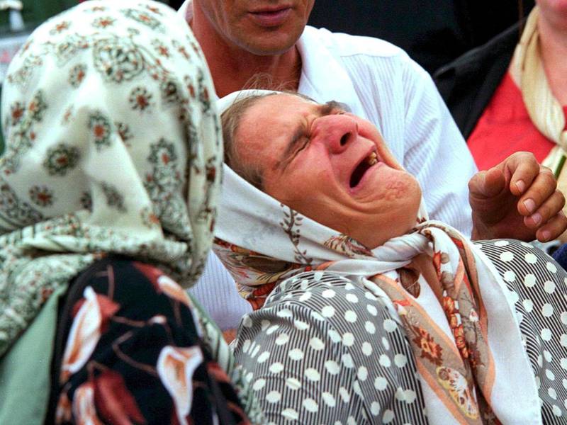 A Bosnian Muslim woman mourns her dead family members as thousands of survivors make an emotional return five years after the massacre to Potocari, Bosnia and Herzegovina, 11 July 2000.  EPA