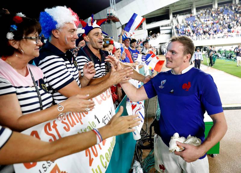 France's Arthur Iturria, right, is celebrated by supporters following their Rugby World Cup Pool C game at Fukuoka Hakatanomori Stadium between France and the United States in Fukuoka, Japan. France defeated the United States 33-9. AP