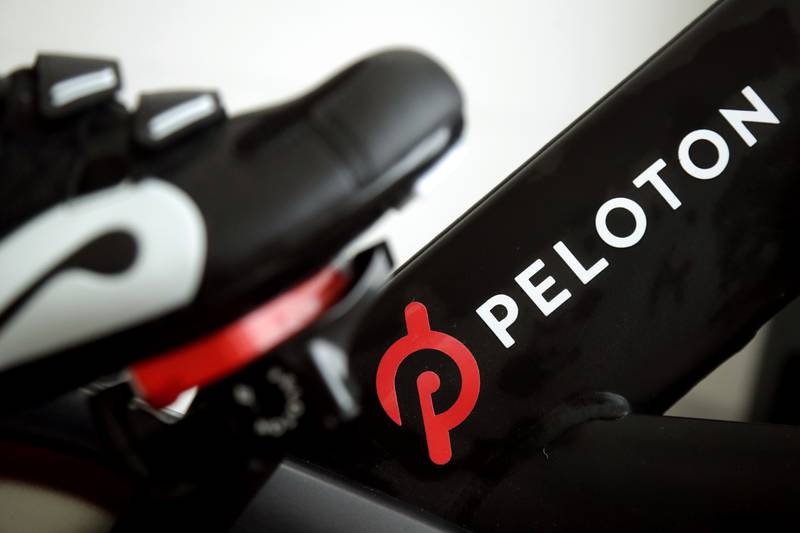 Peloton's shares plummeted after the fitness company cut its annual revenue forecast and lowered its projections for subscriptions and profit margins. AP