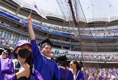 Graduates celebrate at New York University's 2022 commencement ceremony at Yankees Stadium in the Bronx borough. It was followed by special ceremonies for the classes of 2020 and 2021. EPA