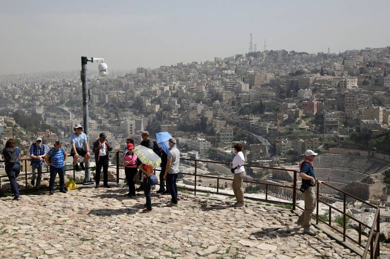 Tourists visit the Roman citadel in the Jordanian capital, Amman. Reuters