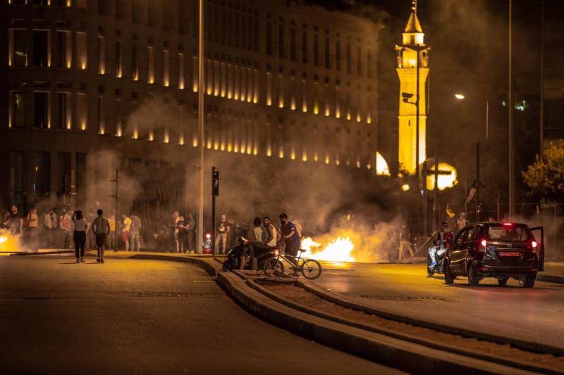 Protesters gather and close roads in Beirut and the suburbs during anti-government rallies on June 11, 2020.  EPA