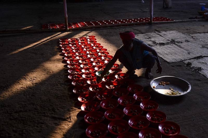 A Bangladeshi volunteer prepares for iftar at a shrine in Dhaka.  AFP