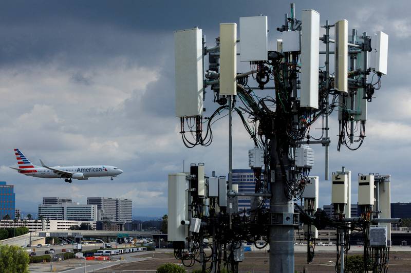 An American Airlines commercial aircraft flies past a cell phone tower as it approaches to land at John Wayne Airport in Santa Ana, California, on January 18. Reuters