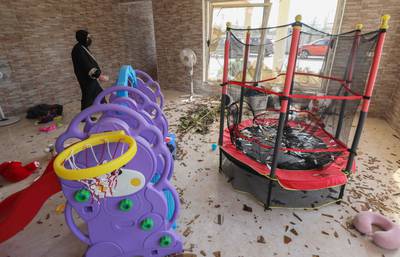 A woman inspects damage in a children's room following an overnight attack in Erbil, the capital of the northern Iraqi Kurdish autonomous region. All photos by AFP