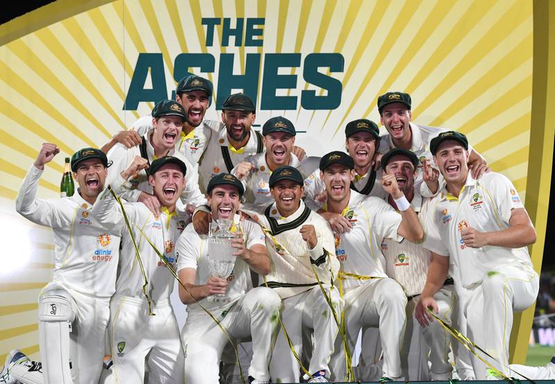 Australia celebrate winning the Ashes series 4-0 after beating England in the fifth Test in Hobart on Sunday, January 16, 2022. PA