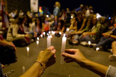 Lebanese women lit candles in support of the anti-government protests at Martyrs' square in Beirut, Lebanon. EPA