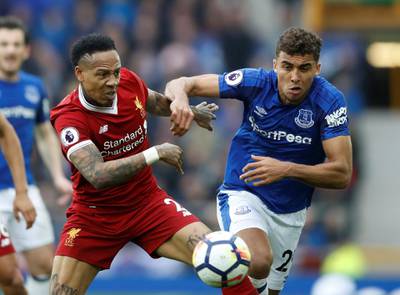 Soccer Football - Premier League - Everton vs Liverpool - Goodison Park, Liverpool, Britain - April 7, 2018   Everton's Dominic Calvert-Lewin in action with Liverpool's Nathaniel Clyne   Action Images via Reuters/Carl Recine    EDITORIAL USE ONLY. No use with unauthorized audio, video, data, fixture lists, club/league logos or "live" services. Online in-match use limited to 75 images, no video emulation. No use in betting, games or single club/league/player publications.  Please contact your account representative for further details. - RC1C9E9CE400