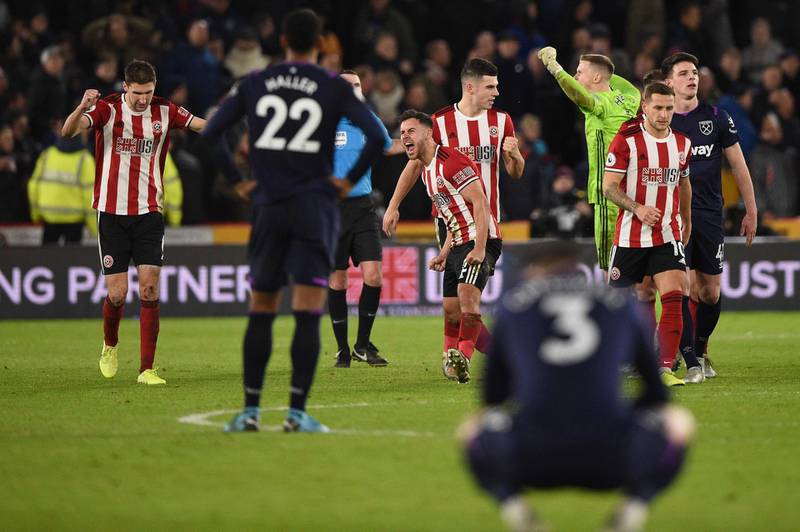 Sheffield United players celebrate as VAR rules out a late West Ham equaliser. AFP
