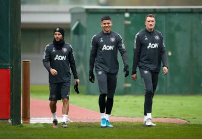 Manchester United's Juan Mata, Marcos Rojo and Phil Jones during the training session at the AON Training Complex. PA