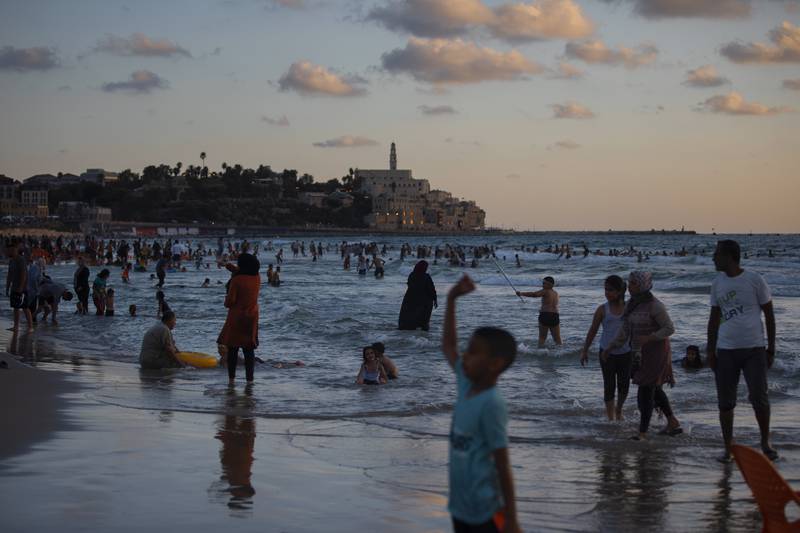 Palestinians enjoy the day on the beach during the Eid Al Adha festival in Tel Aviv, Israel.  The major Muslim holiday, at the end of the hajj pilgrimage to Mecca, is observed around the world by believers and commemorates prophet Abraham's pledge to sacrifice his son as an act of obedience to God.
