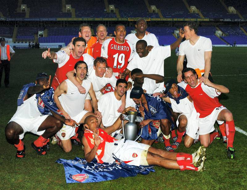 LONDON - APRIL 25:  Arsenal celebrate at the end off the FA Barclaycard Premiership match between Tottenham Hotspur and Arsenal at White Hart Lane on April 25, 2004 in London.  (Photo by Shaun Botterill/Getty Images)