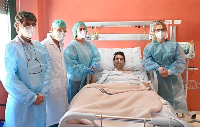 Patient Maurizio Calorio and his wife Silivia Duca, third left, with medical staff after getting married in the intensive care unit at Le Molinette hospital in Turin, Italy.  The hospital granted the dying man's wish to get married and a registrar performed the civil ceremony while he was on life support. A heart transplant opportunity opened while the ceremony was taking place, and the transplant surgery was performed later that night. EPA
