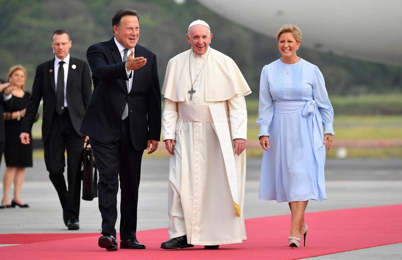 Pope Francis is welcomed by the Panama's President Juan Carlos Varela and his wife Lorena Castillo. EPA
