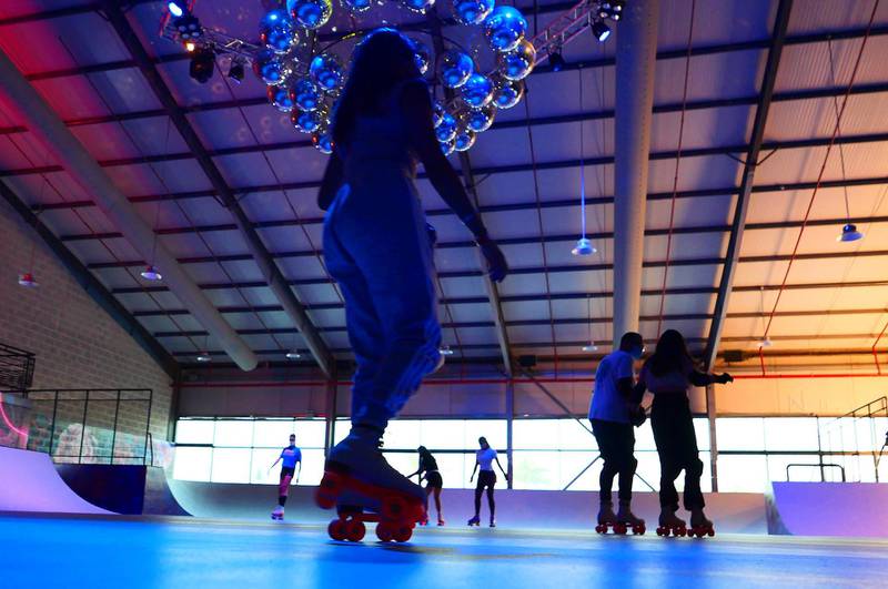 People doing roller skating at the RollDXB roller disco which opens at Shed 3 Marina Cubes Street, Dubai Maritime City, Port Rashid, Bur Dubai on April 25,2021. (Pawan Singh/The National). Story by Sophie Prideaux 