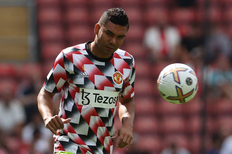 Manchester United's Brazilian midfielder Casemiro warms up ahead of the English Premier League football match between Southampton and Manchester United at St Mary's Stadium in Southampton, southern England on August 27, 2022.  (Photo by ADRIAN DENNIS / AFP) / RESTRICTED TO EDITORIAL USE.  No use with unauthorized audio, video, data, fixture lists, club/league logos or 'live' services.  Online in-match use limited to 120 images.  An additional 40 images may be used in extra time.  No video emulation.  Social media in-match use limited to 120 images.  An additional 40 images may be used in extra time.  No use in betting publications, games or single club/league/player publications.   /  