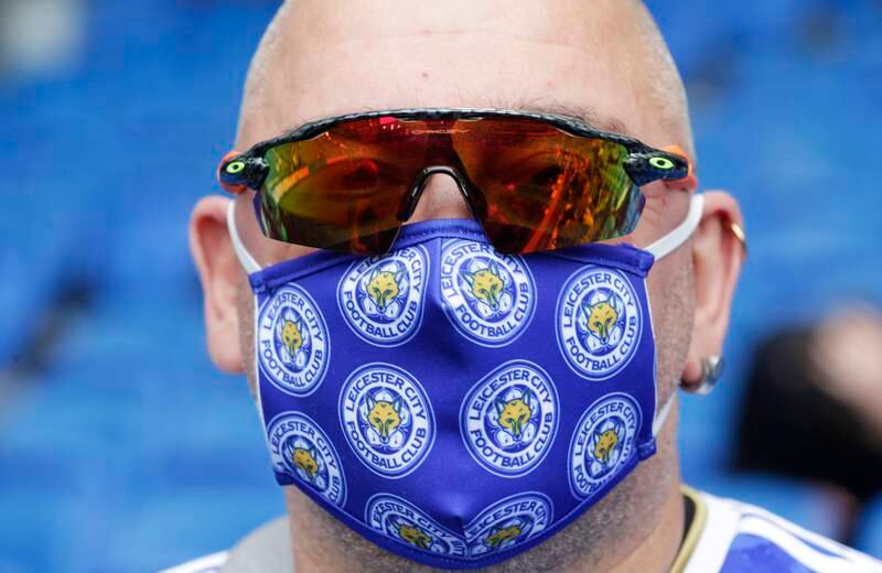 A Leicester City fan wears a face mask before the Premier League away match against Brighton and Hove Albion on September 19. Getty