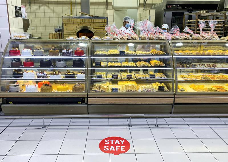 DUBAI, UNITED ARAB EMIRATES. 6 JULY 2020. “We Care” sign by the bakery section at Union Coop in Al Barsha Mall. The sign invites people to maintain social distancing.(Photo: Reem Mohammed/The National)Reporter:Section: