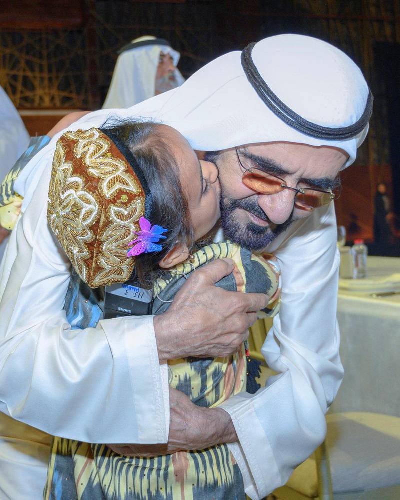 Sheikh Mohammed is embraced by Mahina Ghaniva, 9, from Tajikistan, who underwent heart surgery paid for by Dubai. Courtesy: Dubai Media Office
