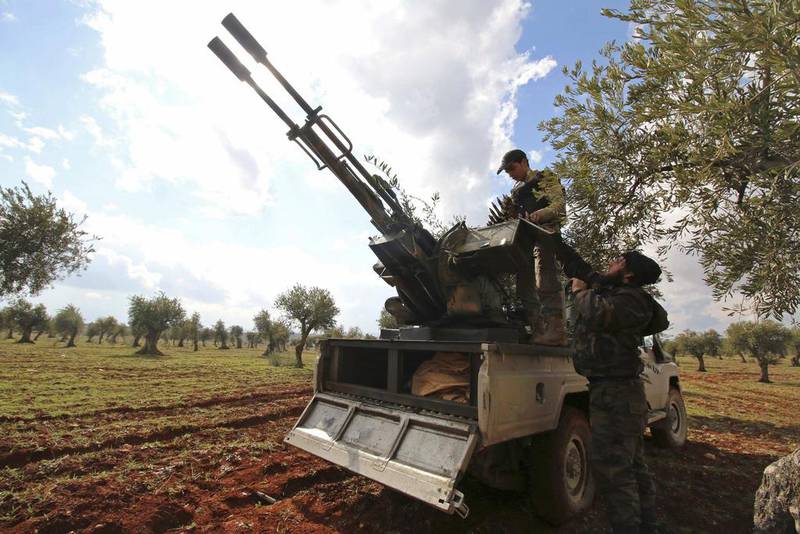 Rebel fighters man an anti-aircraft weapon at the front line against forces loyal to Syria's President Bashar Al Assad near Aleppo on February 17. Ammar Abdullah / Reuters   