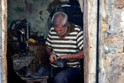Fellow cobbler Walid al-Suri, 58, said 'It's true that our work has increased' but 'there are no profits because the price of all the materials has gone up, from glue to needles, thread and nails'