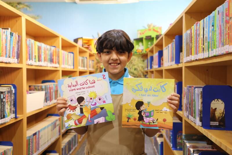 AlDhabi Rashed AlMheiri, 8, with books that set Guinness World Records. Nilanjana Gupta/ The National