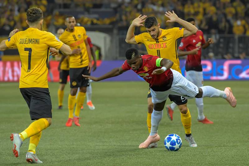 Young Boys' Loris Benito, right back, fights for the ball against Pogba. EPA