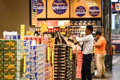 Staff stocking shelves at at Lulu Hypermarket, Abu Dhabi. Khushnum Bhandari / The National