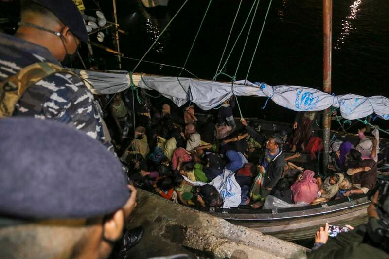 Rohingya refugees in a wooden boat as it arrives in Aceh province, Indonesia, last year.  EPA
