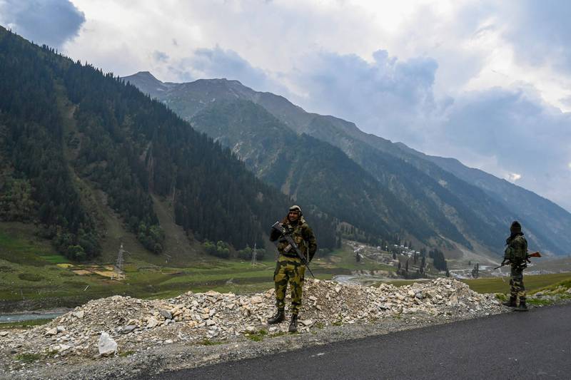 Paramilitary soldiers stand guard near the under-construction Zojila tunnel, which will connect Srinagar to the Indian territory of Ladakh, in Baltal. AFP
