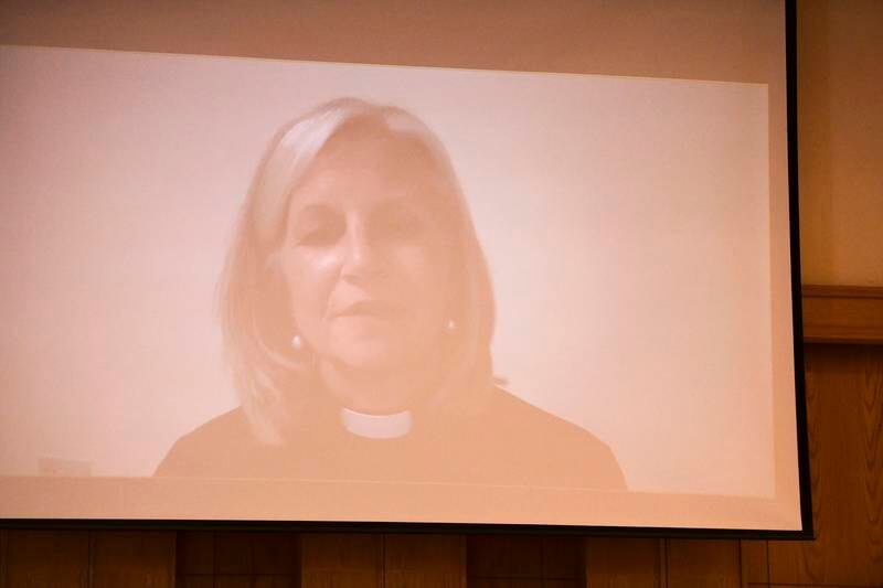 Rev Christine Trainor takes part in the service, via video link. 
