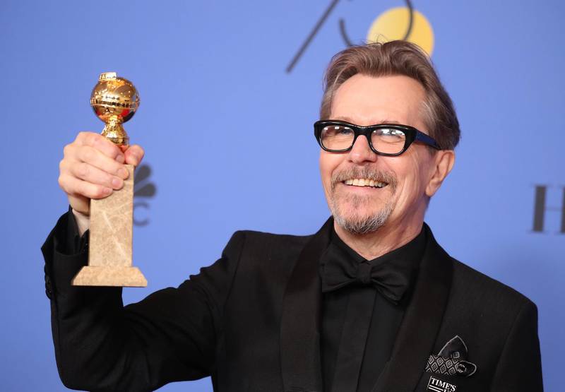 Gary Oldman poses backstage with his award for Best Performance by an Actor in a Motion Picture - Drama for'Darkest Hour. Reuters