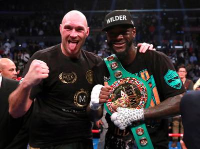 Deontay Wilder and Tyson Fury after the fight. Reuters